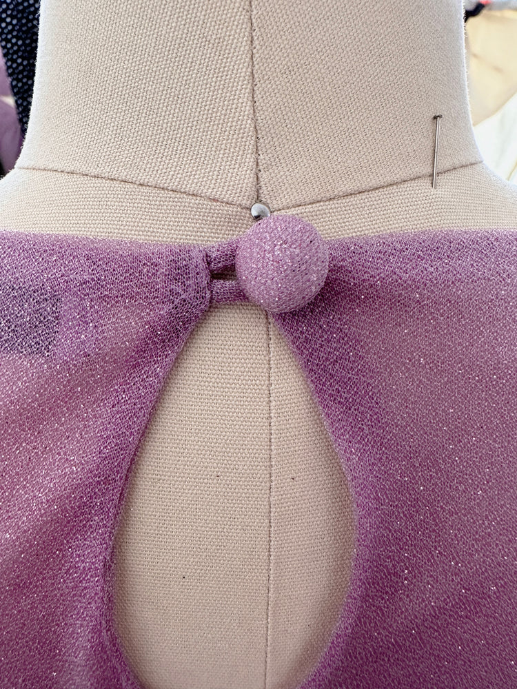 "A beautiful lilac long sleeve saree adorned with glitter, creating a mesmerizing and enchanting look. The shimmering fabric adds a touch of glamour and elegance, making it an ideal choice for any special event or celebration."